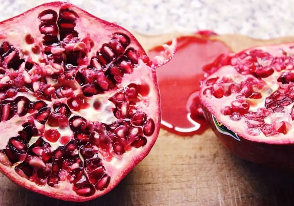 open pomegranate fruit with seeds
