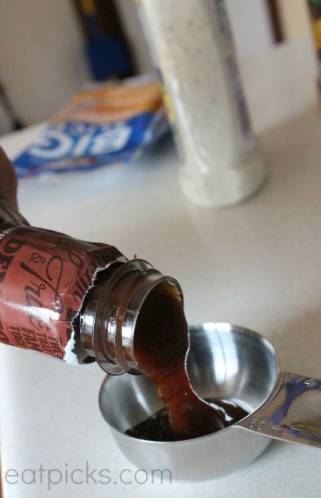 bbq sauce pouring in measure cup