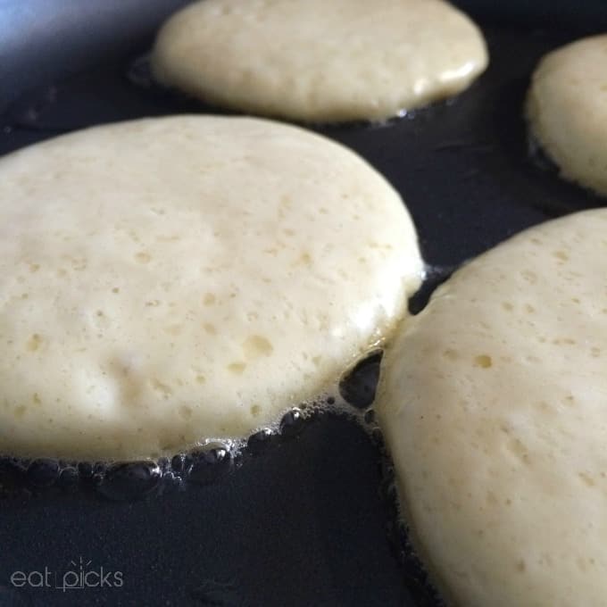 pancakes sizzle in pan