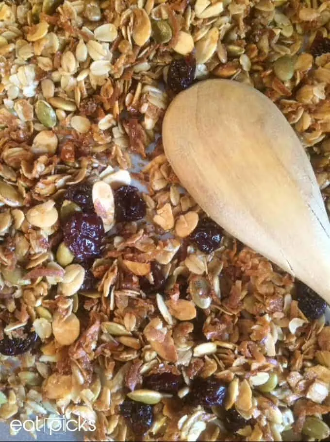 Granola is super easy to make at home! This DIY breakfast recipe is full of fruit, oats, nuts and seeds and goes great with milk or over yogurt!