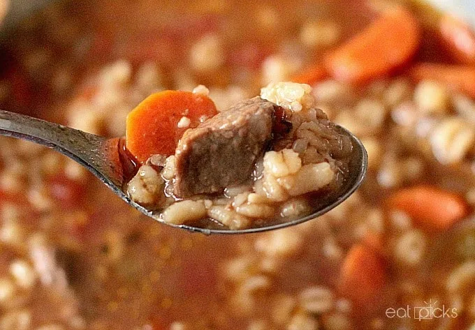 beef barley soup on spoon