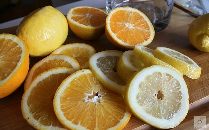 orange and lemon slices on cutting board