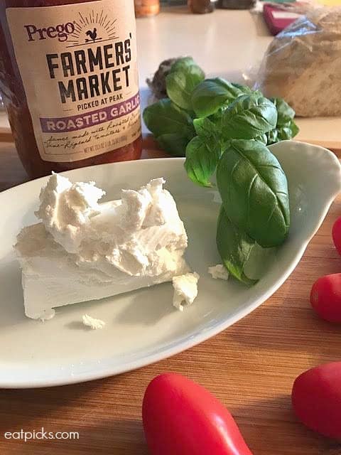 Prego Farmers Market® sauces and fresh goat cheese topped with basil makes an outrageously delicious appetizer for fall!