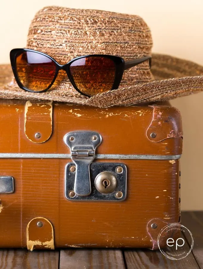 Hat on suitcase travel