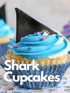 Shark week Fin Cupcakes with blue and purple frosting in paper cupcake wrapper