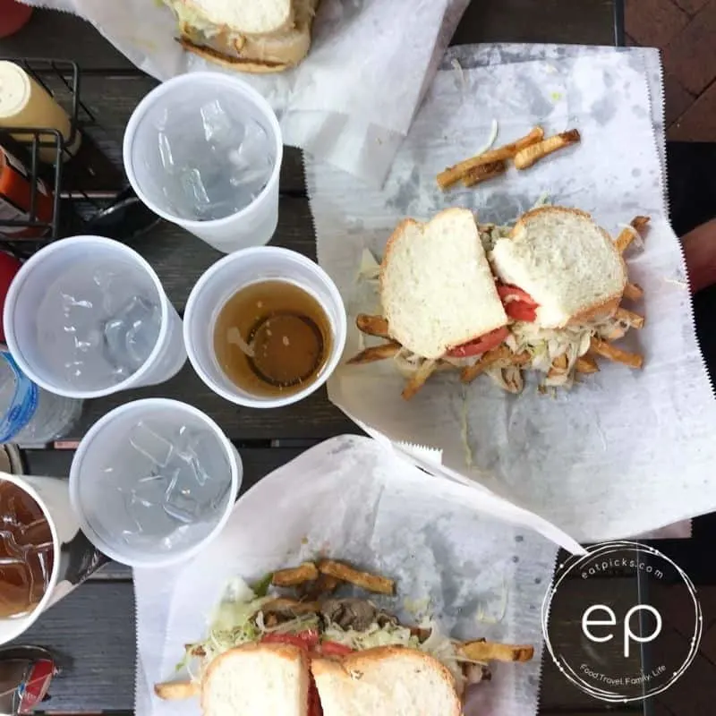 Primanti Brothers sandwich on table with waters