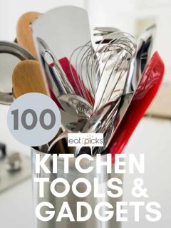 Kitchen tools and gadgets in crock on counter
