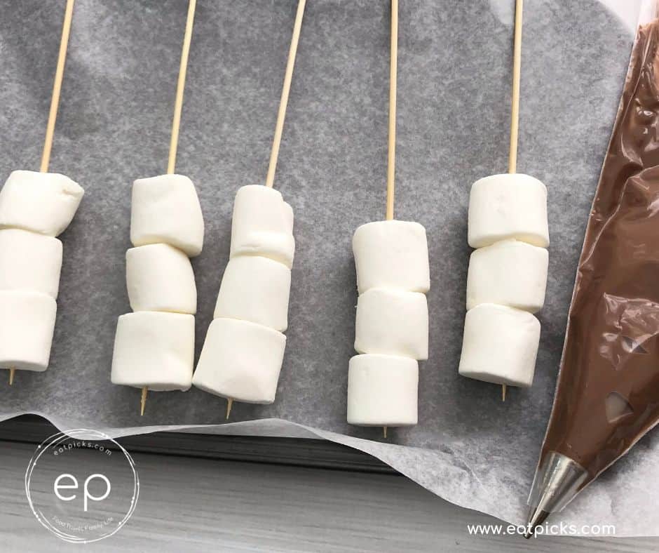 3 plain marshmallows on skewer sticks