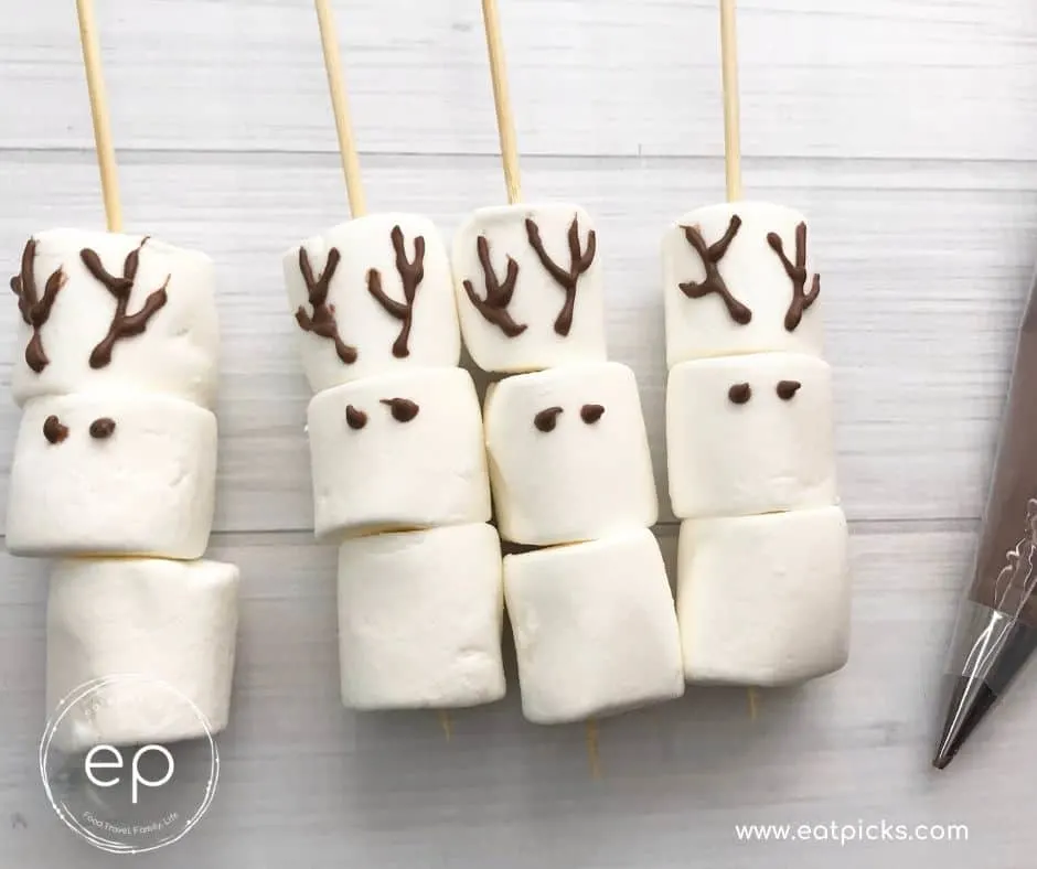 Eyes and antlers on marshmallow reindeer stirrers
