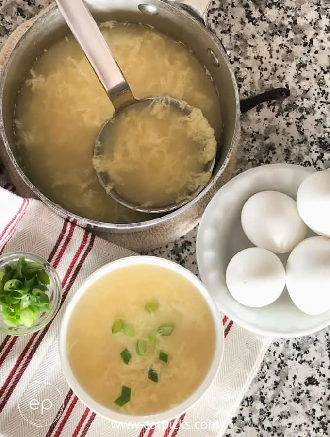 super easy egg drop soup in bowl with eggs 