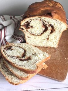homemade cinnamon swirl bread loaf with slices