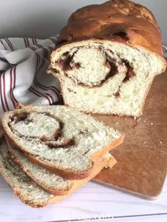 homemade cinnamon swirl bread loaf with slices
