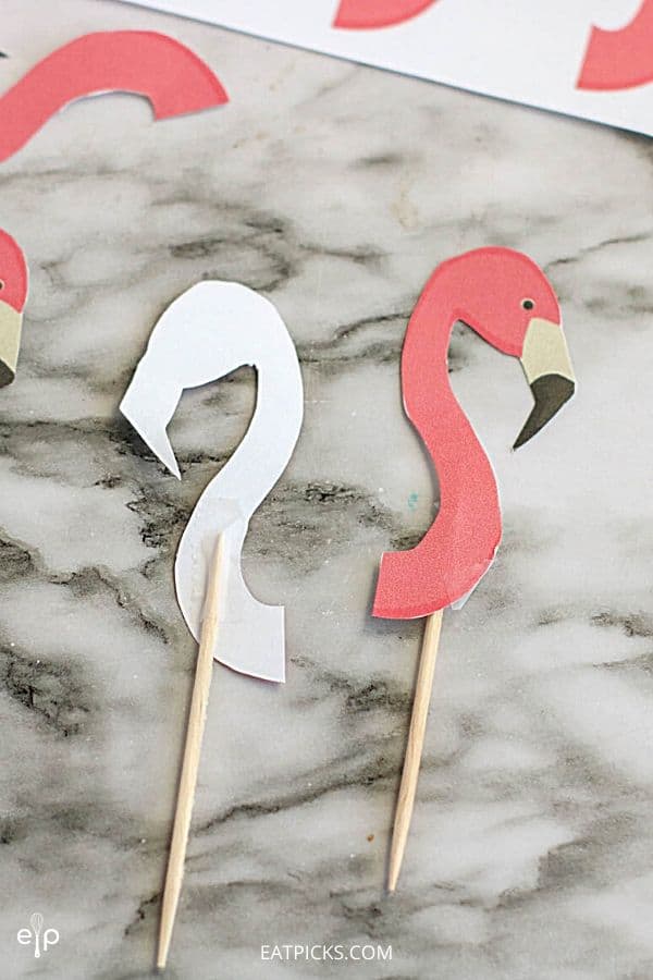 Flamingo cupcake toppers taped to toothpick