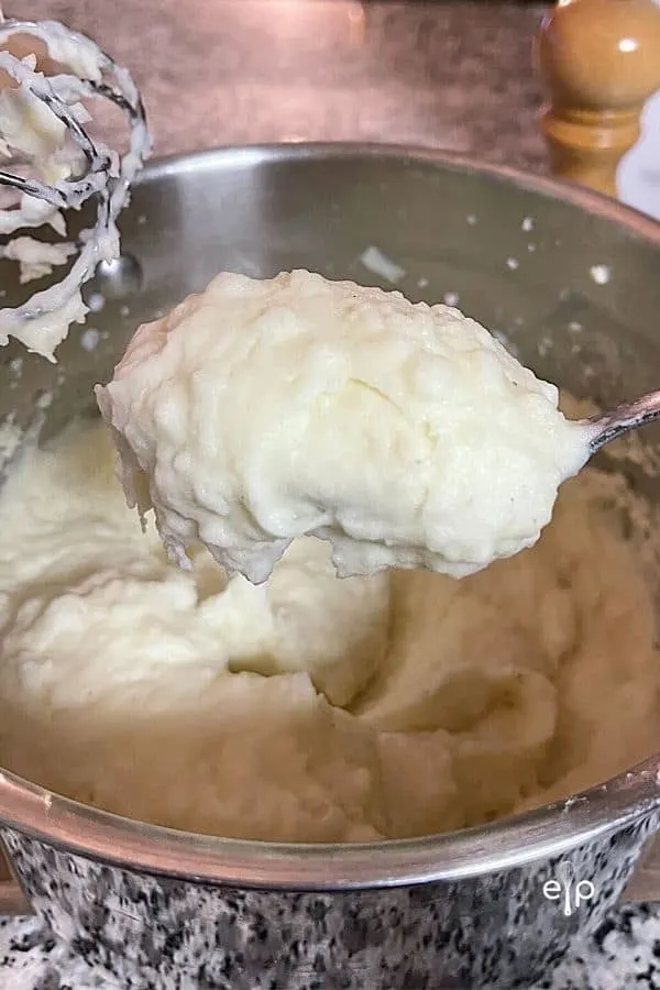 Spoon of creamy mashed potatoes