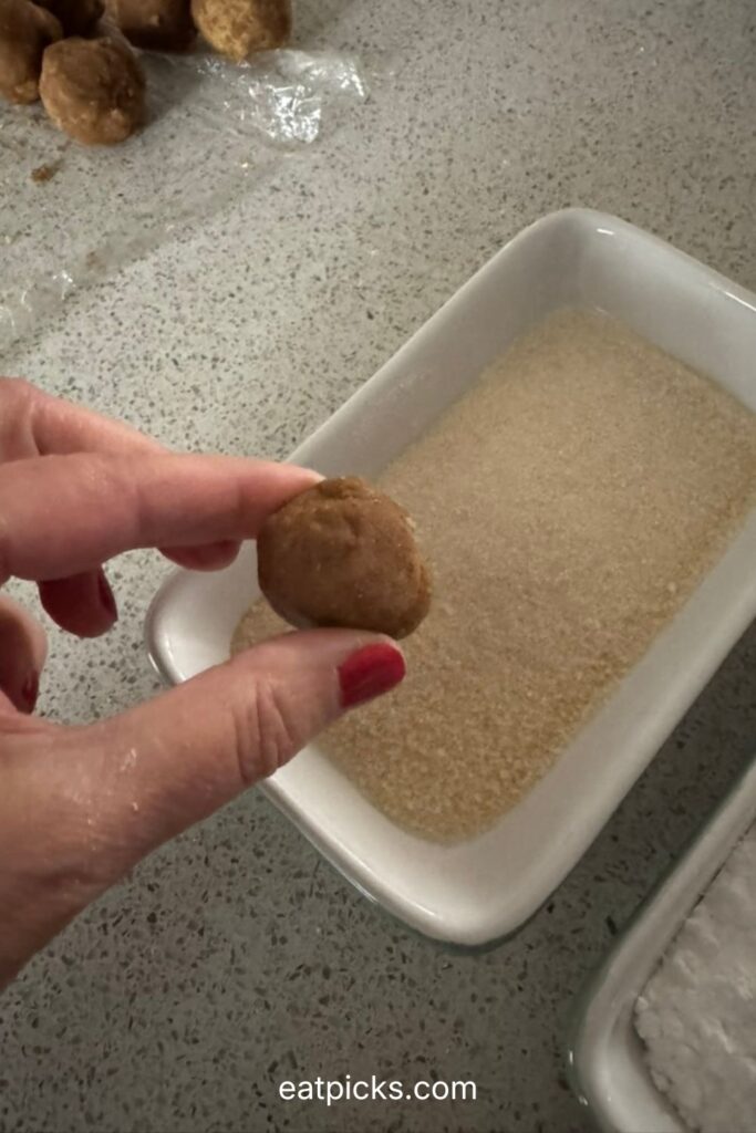 Rolling cookie ball in sugar