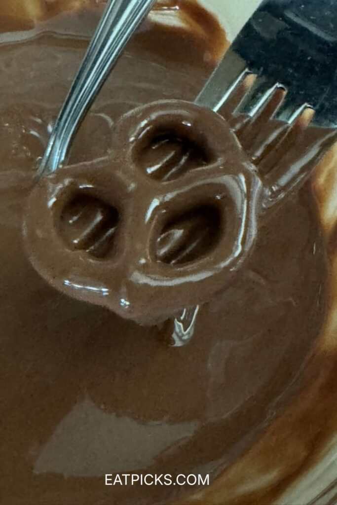 Dipping Pretzel in chocolate