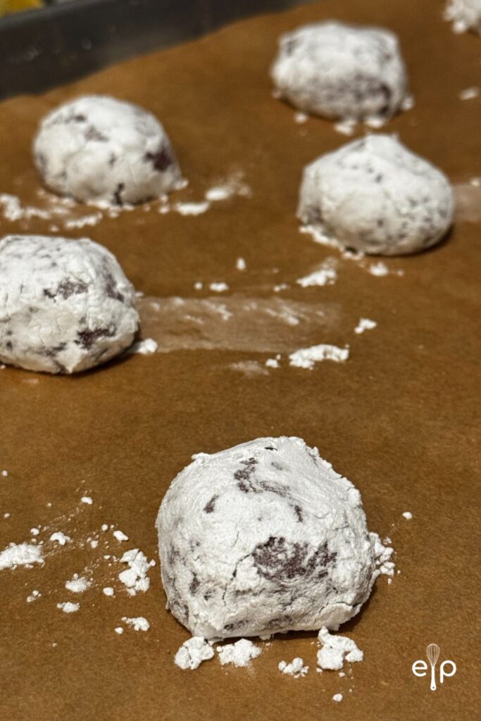 powdered sugar cookies on tray